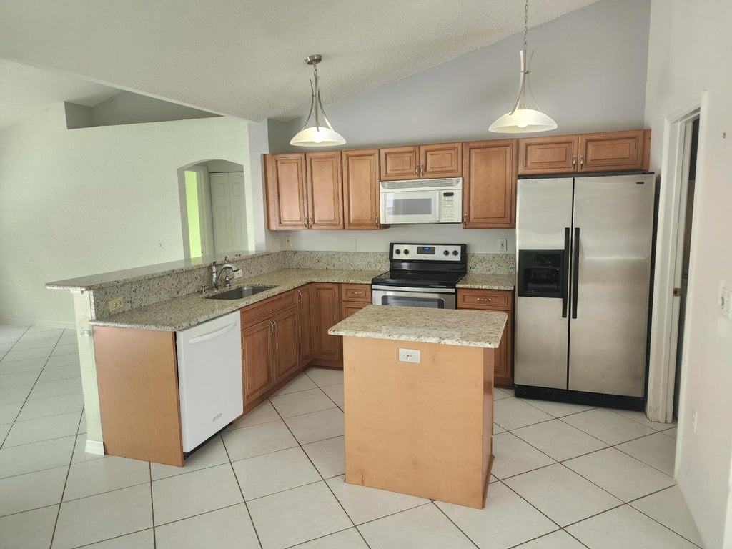 Photo of 1840 SW Kimberly Avenue, Port Saint Lucie, FL 34953 (MLS # R10916343)