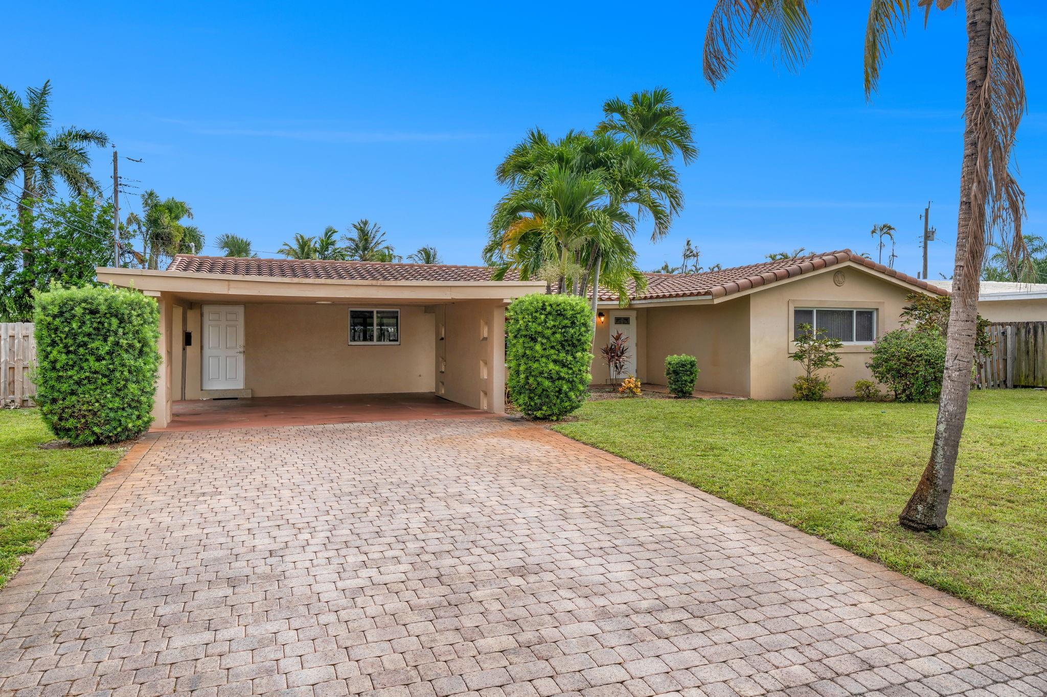 Desirable EAST Fort Lauderdale/ Coral Heights location. 3/2 home with 2 car carport. Fenced yard with screened patio. Impact windows and doors. Tile flooring throughout. Centrally located approx. 2 mile to Lauderdale by the Sea, close to Downtown Oakland Park, Wilton Manors, and Fort Lauderdale. Lawn service is included in rent. Absolutely no smoking or sublet. Rapid approval process. All occupants over 18 must complete a rent spree application (see link).