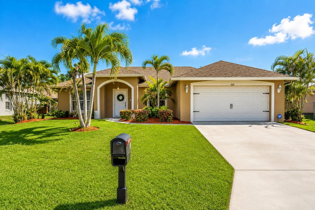 Photo of 400 SW Ridgecrest Drive, Port Saint Lucie, FL 34953 (MLS # B26009779)