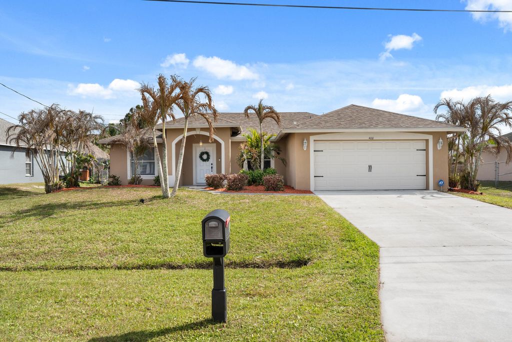 Photo of 400 SW Ridgecrest Drive, Port Saint Lucie, FL 34953 (MLS # B26009779)