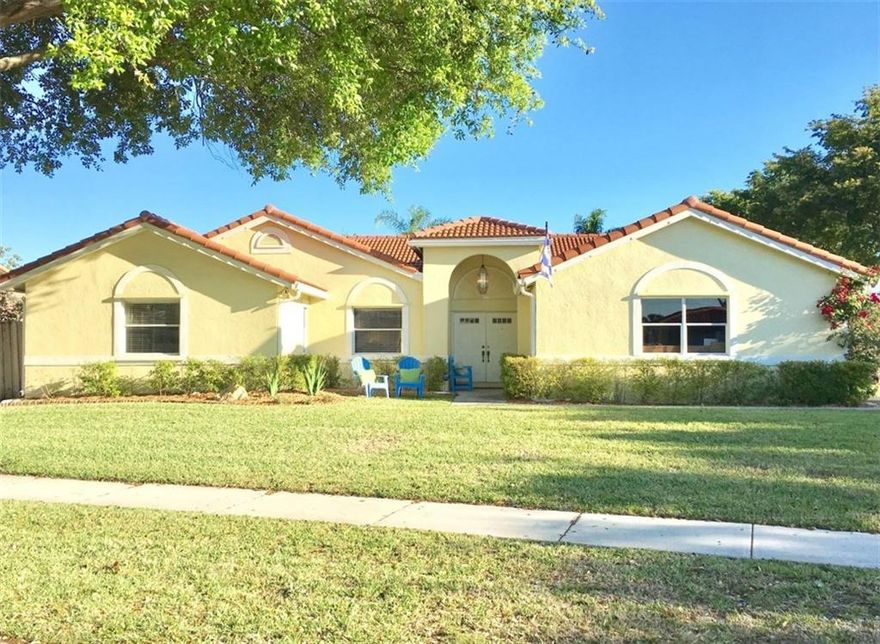 A Perfect FAMILY HOME in the heart of Plantation! A premier corner lot with oversized front and back yard with pool and playground for the kids. Easy access to 595, I-95, downtown, and major shopping areas and great schools. A newer built home in an established, tree-lined neighborhood that boasts impressive vaulted ceilings and bright open floor plan with views of the pool from all living areas and master. Modern, light gray walls throughout main living area. Newer barrel tile roof replaced in 2014.