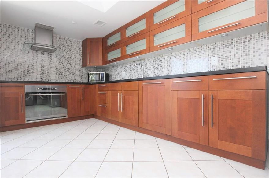 Completely remodeled, very spacious 2bd/ 2ba+ DEN corner unit in Wellesley Park in the heart of Boca Raton, in a secure building with nice views. Excellent central location, minutes away from beaches, shops, major hwys & downtown. Property features wood floors throughout living areas & bedrooms, custom made kitchen, granite counter tops, stainless steel appliances, washer & dryer in unit, AC 2012, water heater 2010, no popcorn ceilings, huge walk in closet, 2 screened balconies, extra storage room in building. HOA is $578/mo & includes Water/Sewer, trash, common area, lawn, insurance & building exterior. Community amenities include club room, pool, Jacuzzi, BBQ. Only service dogs/emotional support pets allowed, as per HOA. A must see! It shows better in person.