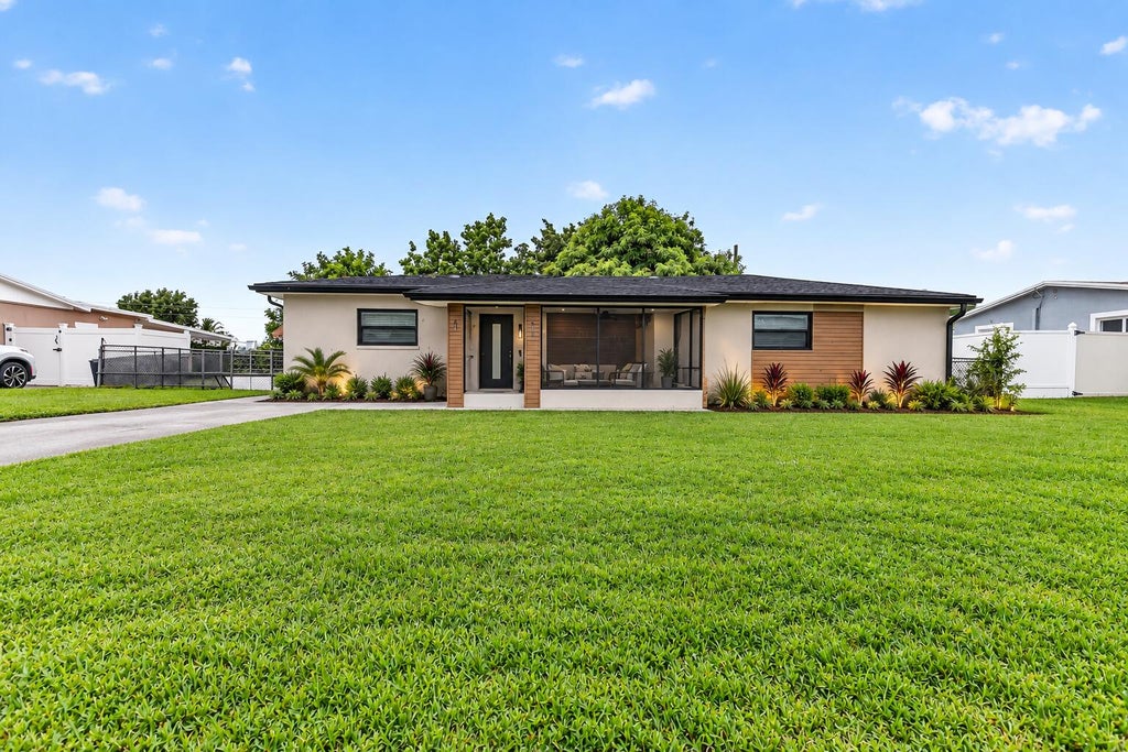 Photo of 913 JAMAICAN Drive, West Palm Beach, FL 33415 (MLS # B26085972)