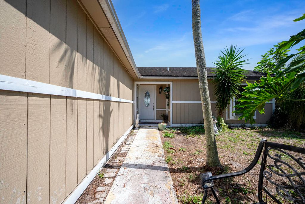 Photo of 1062 SW Payne Avenue, Port Saint Lucie, FL 34953 (MLS # R10988545)