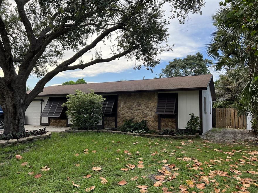 Spacious Beautiful house renovated, in very quiet residential neighborhood, no carpets!, tile throughout the house, remodeled  bathrooms, interior/exterior doors, closets, int/exterior painting, stainless steel appliances, washer dryer. One car garage with space in driveway for 3 more cars. Home featuring FENCED BACKYARD AREA with a large wooden deck. Sprinkle system. No HOA- No rules!. Park your truck, trailer, boat right in front of your house. Perfect location! 5 min away Costco, Target, Walmart, Aldi, Trader Joe, Publix. 10 min away Gardens Mall, beach, intercostal, and many restaurants.
