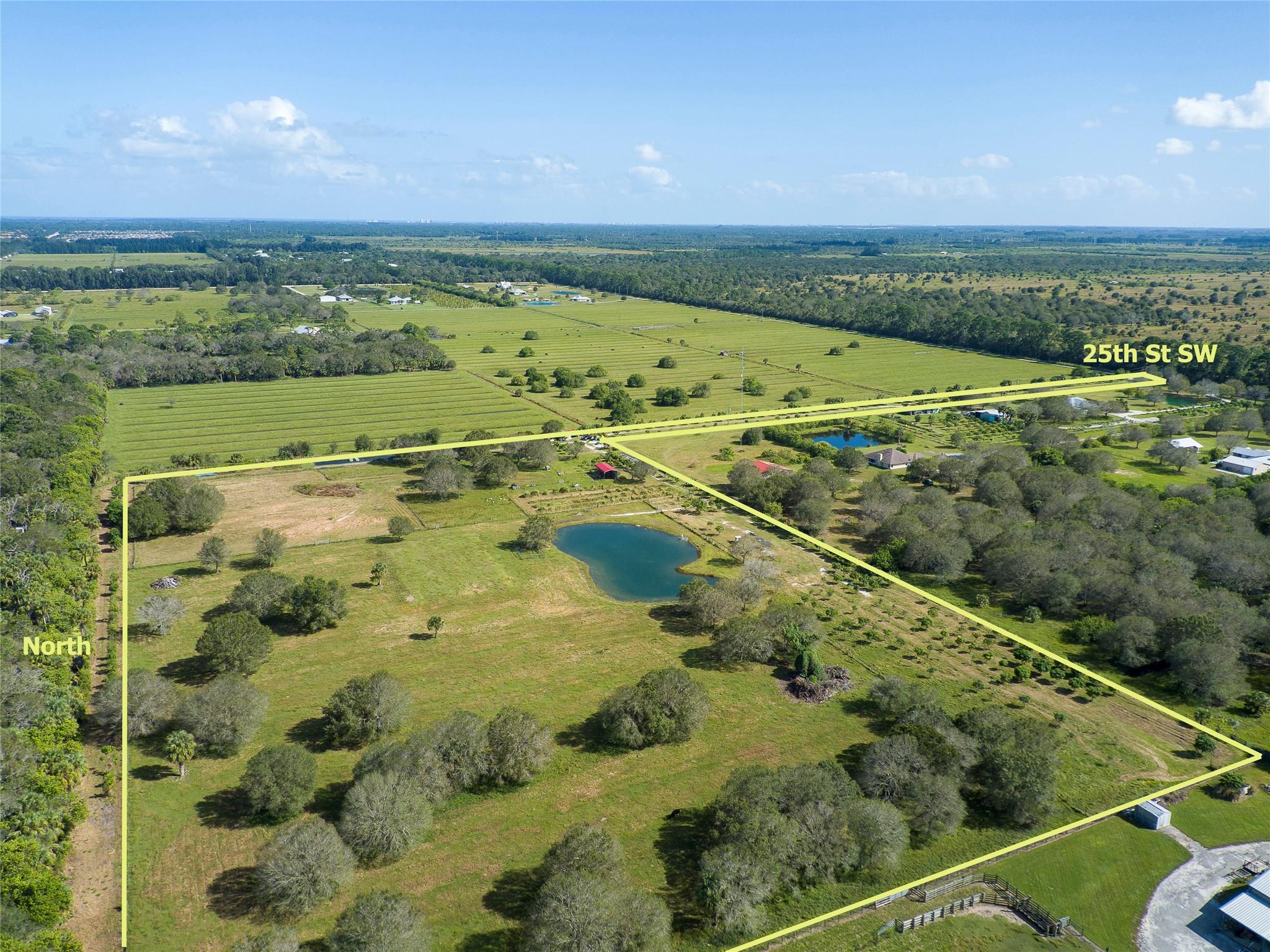 Enjoy the country lifestyle on this highly desirable 17acre parcel loaded with mature oak trees and many varieties of fruit trees! Shared artesian flow well, serene pond with aerating fountain, raised building pad for your future home or garage, perimeter fencing with subsection fencing, 4 metal outbuildings will convey with sale. Some electric and irrigation lines in place. Please do not access property without Listing Agent.
