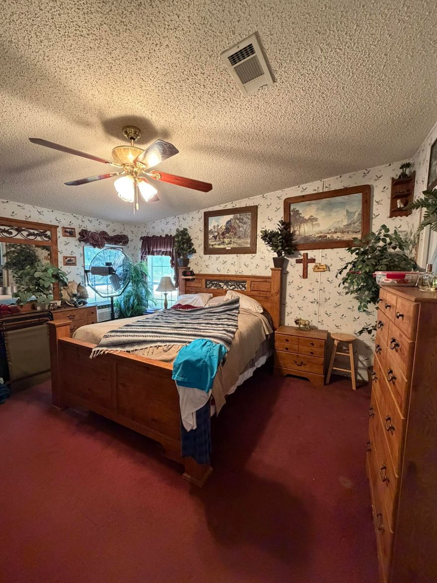 Beautiful 3 bedroom 2 bath home situated on over a half acre (.67) on a spacious corner lot in a peaceful country setting.  The property is fully enclosed with a chain ink fence with a concrete circular driving, welcoming you home.  This home features two sheds, one 8x10 and a larger 10x20 providing plenty of space for tools, equipment, or hobbies.  The home is equipped with a Kinetico water system, and the AC unit was installed in 2021 for added comfort and efficiency.  The roof was completed in 2004.  Priced at just $195,000 , this property is an excellent opportunity for a first-time homebuyer or anyone looking for quiet, country living.  Don't miss out on this rare opportunity.  This one won't last long!