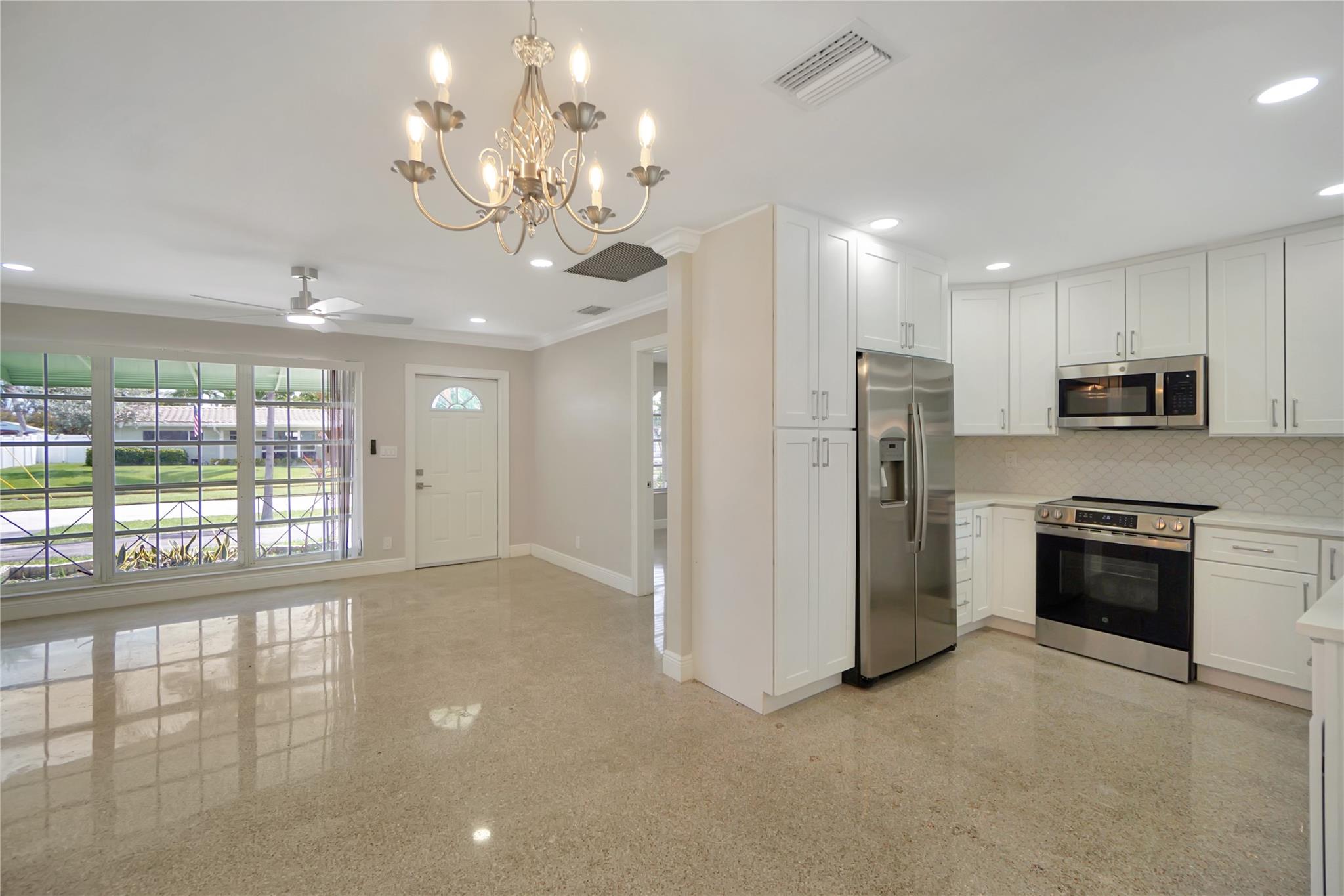 Live just minutes from the beach in this beautifully renovated single-family pool home in prime Deerfield Beach! Featuring a modern kitchen with sleek cabinets, counters, and stainless-steel appliances, plus updated bathrooms, this home is move-in ready. Enjoy polished terrazzo floors with tile accents, a spacious den that can be used as a 4th bedroom, and a large backyard perfect for entertaining or relaxing by the pool. Additional highlights include a covered carport, circular driveway, and a highly desirable location east of US-1/Federal Hwy. Close to parks, top-rated schools, shopping, restaurants, gyms, nightlife, and Hillsboro Beach. A perfect rental opportunity for families looking to enjoy everything South Florida living has to offer! $1,000 Non-Refundable Pet Deposit, per pet.