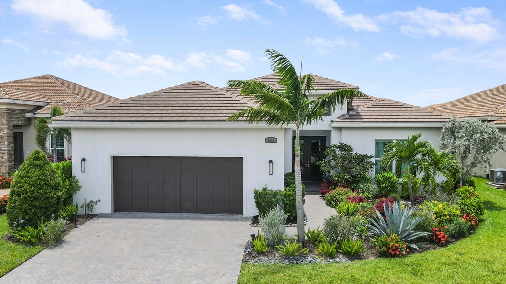 Photo of 8680 SW Flutto Way, Port Saint Lucie, FL 34987 (MLS # R11048328)