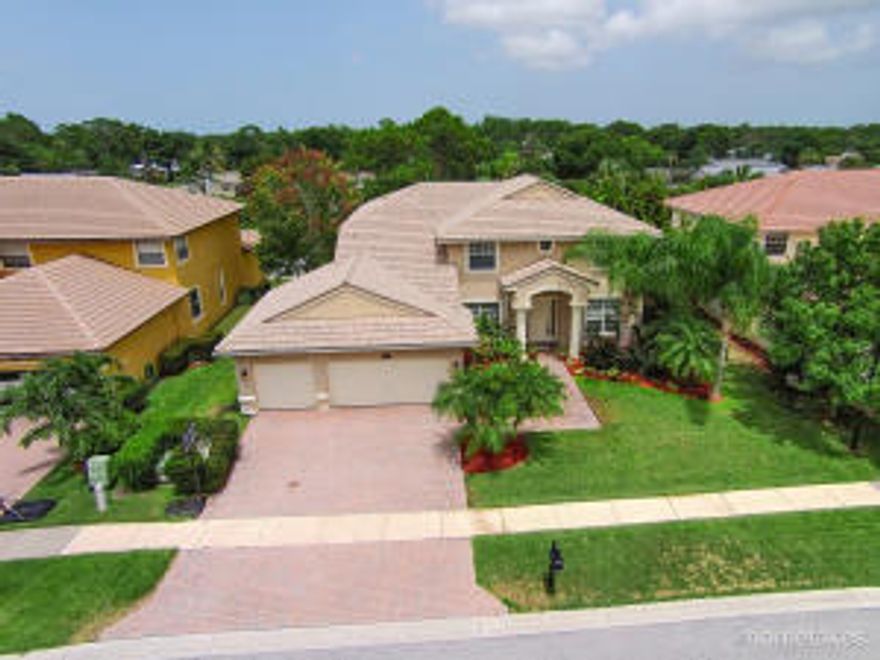 Fantastic home in the best location! Must see! Shows like a model home. This spectacular estate boasts 5 bedrooms, 3 full baths, a 3 car garage, covered rear lanai, custom pergola and a one of a kind outdoor fireplace. The two story home is in a great location near the back of the community. Oakbrooke Estates is a 72 home community, near the number 1 schools in the State of Florida. Great community, with sidewalks on both sides of the road, and a private gate in the rear of the community, that allows you to take your children to Palm City Elementary without the daily car line experience. Don't miss this home, as there were only two models built in the community.