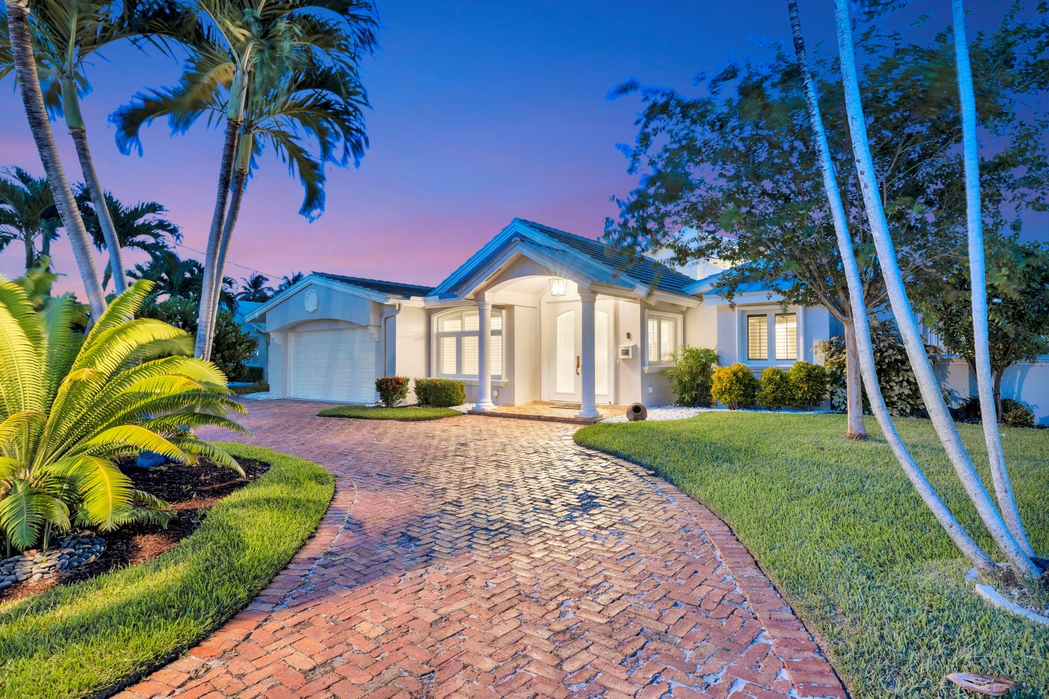 LIVE THE ULTIMATE SOUTH FLORIDA LIFESTYLE IN THIS BEAUTIFULLY UPDATED WATERFRONT HOME LOCATED IN SOUGHT-AFTER EAST POMPANO. THIS 3-BEDROOM, 2-BATH RESIDENCE BOASTS AN OPEN FLOOR PLAN W/ SOARING VAULTED CEILINGS & ELEGANT MARBLE FLOORS, CREATING A BRIGHT & AIRY LIVING SPACE PERFECT FOR ENTERTAINING. THE HEART OF THE HOME IS THE CHEF-INSPIRED KITCHEN, FEAT. LARGE ISLAND, HIGH-END APPLIANCES W/ GAS RANGE, DOUBLE OVENS & PLENTY OF ROOM FOR GATHERING W/FRIENDS & FAMILY. UPSTAIRS, A SPACIOUS LOFT/PLAYROOM OPENS TO 26' BALCONY OVERLOOKING THE SPARKLING POOL & WIDE CANAL. TRAVERTINE-PAVED POOL AREA W/ LUSH LANDSCAPING. NEW 65' COMPOSITE DOCK. IMPACT WINDOWS/DOORS. CUSTOM WAINSCOTING. 3-ZONE AC W/ NEW DUCTS. ROOF 2019. POTENTIAL FOR 4TH BEDROOM. A PERFECT BLEND OF LUXURY, COMFORT & COASTAL LIVING.