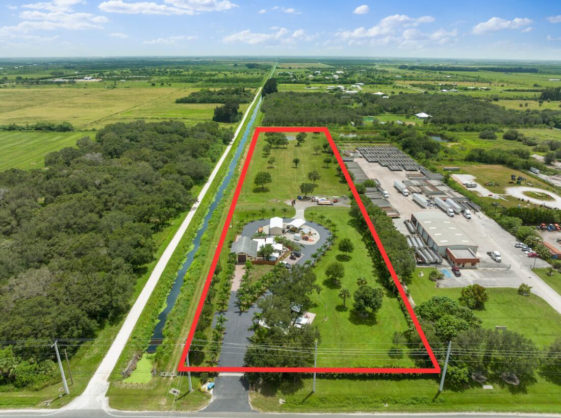 Welcome to your ideal work/life compound! Situated on this 7.65 acre industrially zoned property is a total of 10 individual buildings perfectly designed for comfort & convenience for your business. The main CBS building totals 2,240sqft and includes room to store an RV, separate personal storage, and a 2 bedroom / 2 bathroom apartment that is completely renovated! Outside the main building includes a detached air conditioned office space, 6'x20' screened-in jacuzzi spa, and an outdoor kitchen/BBQ area. Don't miss the 20'x40' metal barn and 20'x30' metal pole barn, both built in 2017! The whole property is protected by top of the line security cameras and privacy landscaping. The remaining back half of the property is undeveloped & ready for more infrastructure!
