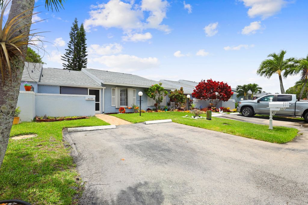 Photo of 4325 Lucerne Villas Lane, Greenacres, FL 33467 (MLS # B26033757)