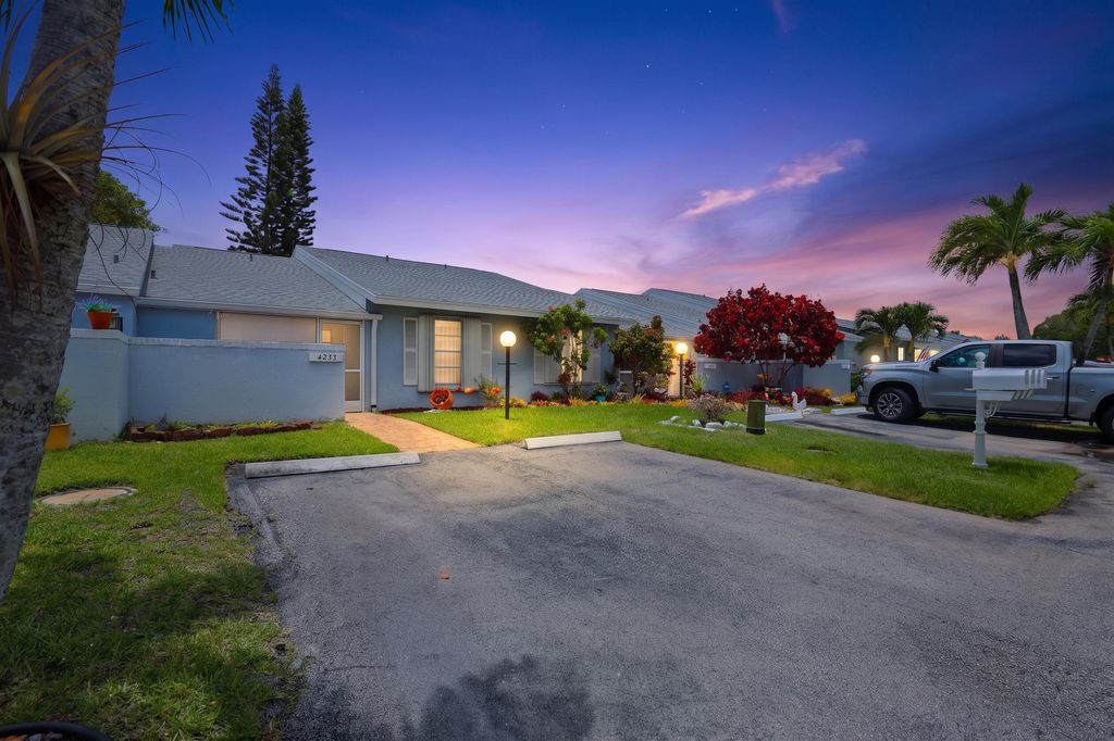 Photo of 4325 Lucerne Villas Lane, Greenacres, FL 33467 (MLS # B26033757)