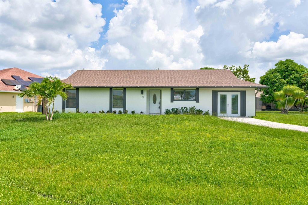 Photo of 1191 SW Lawndale Avenue, Port St Lucie, FL 34953 (MLS # R10910592)