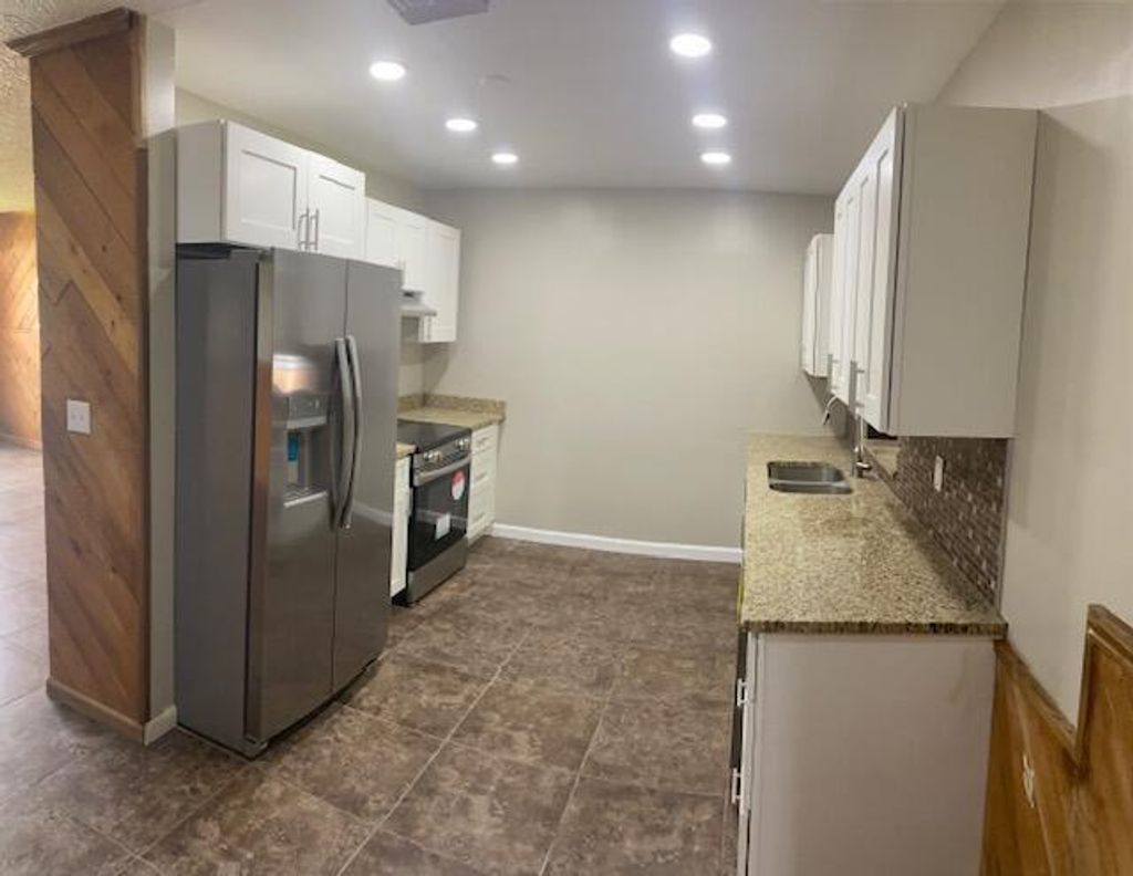 Photo of 1033 SE 2nd Street, Belle Glade, FL 33430 (MLS # R10990395)