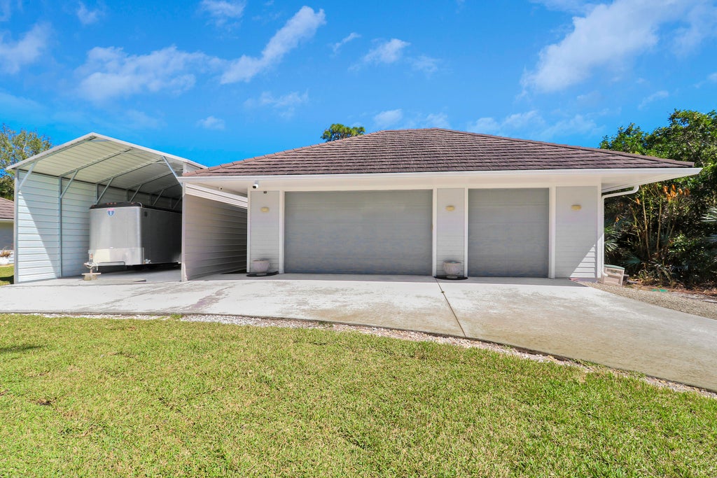 Photo of 815 N E Stokes Terrace, Jensen Beach, FL 34957 (MLS # B26073716)