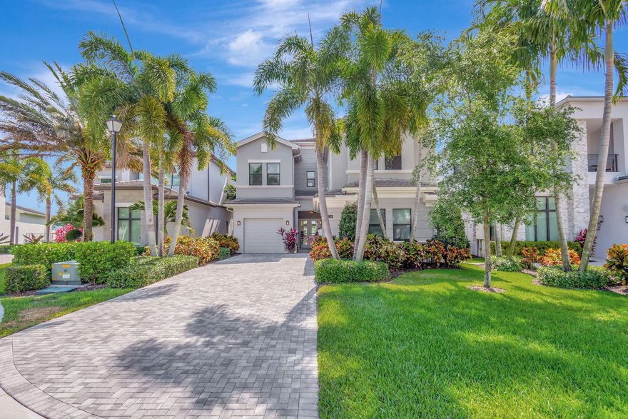 Love Where You Live! Enjoy the fabulous lake view and Florida living at its finest in the stunning, estate home in Boca Bridges.  As a former model the builder showcases all the bells and whistles in the  2-story Anabelle floor plan with 5 bedrooms, loft, club room, 6 baths, and a 3-car garage. The Transitional styling welcomes you to this private cul-de-sac location. Completely upgraded with architectural finishes throughout that make this home special and unique.  The spacious kitchen is ideal for entertaining.  The covered patio and gorgeous pool and spa overlook the lake.