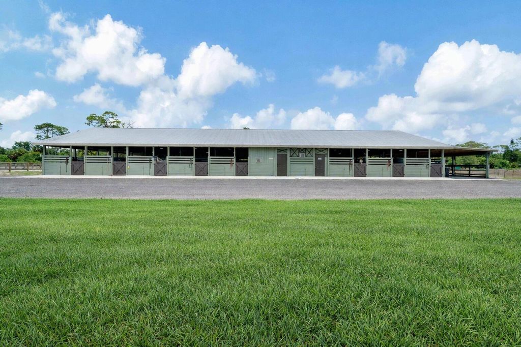 Photo of 14845 Collecting Canal Road, Loxahatchee Groves, FL 33470 (MLS # R11148754)