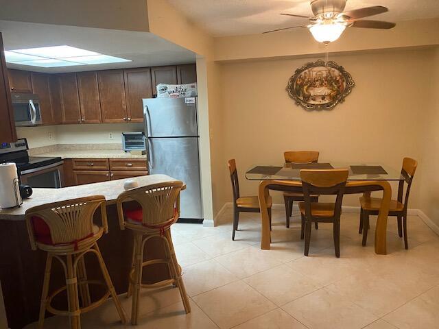Available Now! Located on the First Floor Unit A a beautifully partially furnished 2-bedroom, 2-bathroom condo nestled in the heart of Jupiter. With nearly 1,000 sq. ft. of thoughtfully designed living space comfort and convenience for annual renters Owner will remove furniture should tenant desire . Open concept layout featuring Tile Flooring flooring in main living areas and carpeting in bedrooms. Open concept living with screened terrace