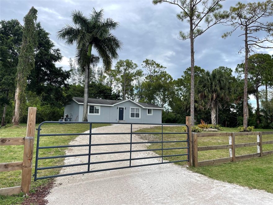 Discover Your Dream Home in Loxahatchee, Florida! Welcome to a slice of paradise! This stunning house  offers the perfect blend of modern amenities and spacious living on over 1.29acre of lush greenery. Completely renovated to perfection. Step inside and be amazed by stylish stainless-steel appliances.  Grey shaker cabinets, complemented by the exquisite quartz kitchen island and countertops. The thoughtfully designed vanities in the bathrooms add a touch of luxury to your daily routine. A brand new water heater and A/C system, and the added bonus of a washer and dryer.  With a spacious shed on the property,  Beyond the walls, you'll find yourself immersed in the tranquility of nature.  .Embrace the joys of country living while still being close to city amenities.