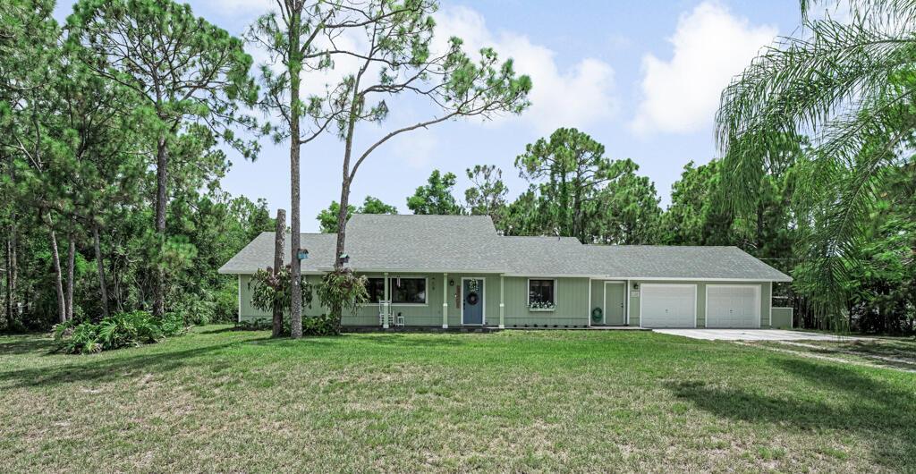 Home Sweet Home ! Welcome to this much loved and well maintained 4 bedroom 2.5 bath home close to shopping, schools and restaurants but yet offering a quiet place to call home.Peace of mind will be yours with a brand new roof (2025) Hurricane-rated garage doors (2024) Hurricane- rated accordion shutters (2023) Hurricane-rated exterior doors (2022) all this along with Anderson Brand double paned windows and sliders. Inside you will find a spacious living room that leads into an open dining room and kitchen that is perfect for holiday and weekend gatherings.