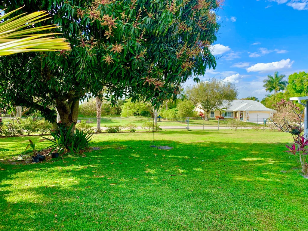 Photo of 331 NE Camelot Drive, Port Saint Lucie, FL 34983 (MLS # R10959198)