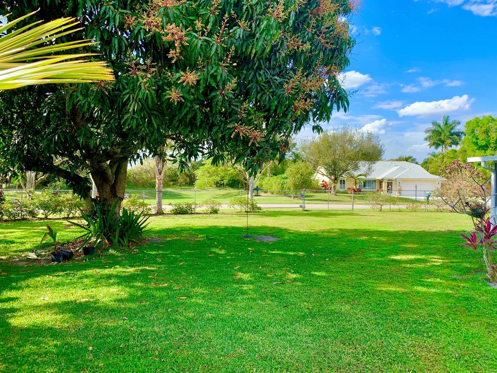 Photo of 331 NE Camelot Drive, Port Saint Lucie, FL 34983 (MLS # R10959198)