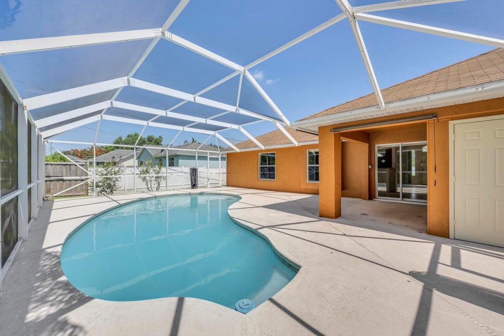 Photo of 5075 NW Egret Avenue, Port Saint Lucie, FL 34983 (MLS # B26059992)
