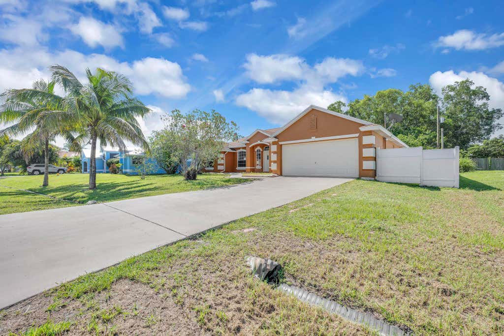 Photo of 5075 NW Egret Avenue, Port Saint Lucie, FL 34983 (MLS # B26059992)
