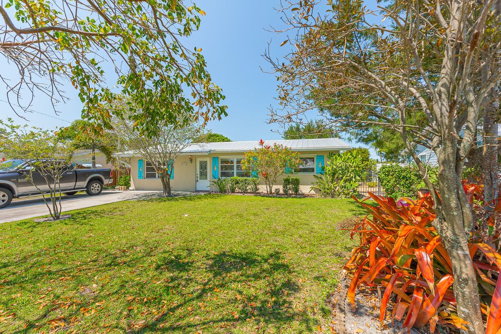 Photo of 1079 NE Crescent Street, Jensen Beach, FL 34957 (MLS # R11078765)