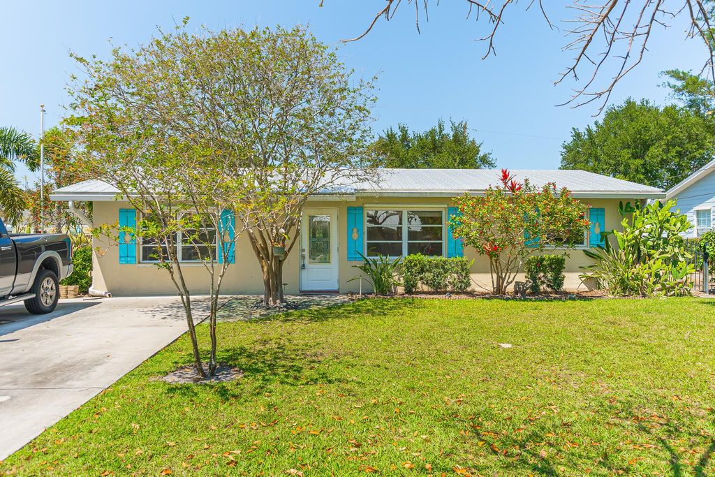 Photo of 1079 NE Crescent Street, Jensen Beach, FL 34957 (MLS # R11078765)