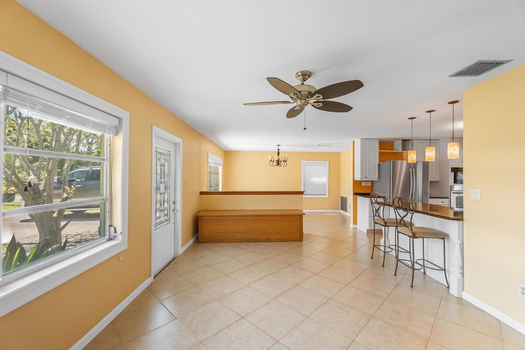 Photo of 1079 NE Crescent Street, Jensen Beach, FL 34957 (MLS # R11078765)