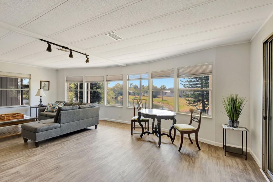 Florida's Paradise! FULLY FURNISHED, NEWLY REMODLED 2 bedroom 2 bath home!  Short 15 minute commute to Vero Beach Airport.  Peaceful and private waterway with scenic views.  Watch beautiful sunsets from the comfort of your backyard.  Wood plank flooring (3/4 thickness) throughout and luxury features. Chef inspired kitchen.  Spacious living and separate dining perfect for entertaining.  Enjoy a great book and relaxing conversations sitting in your enclosed Florida room (Lenai).  Metal Roof, A/C 2 yrs, Water Heater 2 yrs, brand new Washer and Dryer included.  Located within the sought after Countryside 55+ Active community.  Enjoy social activities such as Bingo nights, Veterans appreciation and birthday celebrations.  Sparkling heated pool, Get Fit gym, Pickleball and so much more!