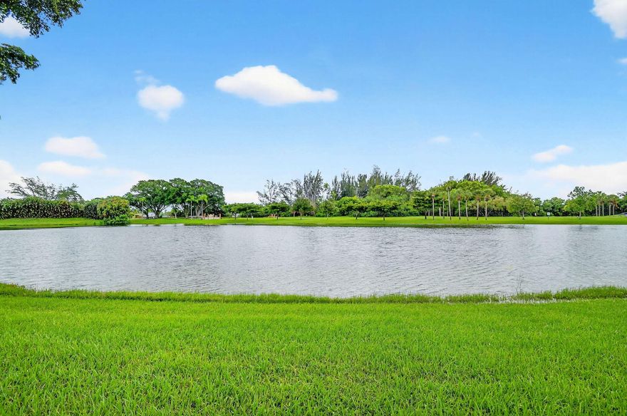 Reduced for quick sale! Stunning Views the moment you open the door. Your expansive air conditioned lanai invites you to enjoy year round indoor/outdoor living & sunsets that make every day feel like vacation. This beautifully updated home features a split floor plan, soaring ceilings, & tile flooring throughout. Entry w/motion-sensor lighting, a covered front porch & a carport w/tons of storage. Enter with a secure Anderson storm door as once inside, natural light pours into the spacious foyer, formal dining, & open living areas. Modern kitchen w/newer appliances flow seamlessly into the dining & living rooms, all overlooking the lake. The primary suite also boasts serene water views and updated bath. The wraparound air-conditioned patio, expands your living space lake views from the kitchen, dining, living, & primary bedroom. With a newer AC and water heater, abundant closets & stylish updates, this home blends comfort & elegance w/the relaxed charm of Florida you've been looking for!!