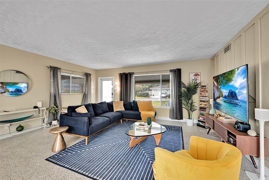 MAJOR PRICE IMPROVEMENT! Plus NEW ROOF and CAST-IRON PIPE RE-LINING to be completed prior to closing—offering unmatched value and peace of mind. Updated 3BR/2BA Mid-Century home in Middle River Terrace, just steps from the 18th St dock. 1,515 SF on a 6,757 SF lot with timeless character and modern upgrades. Renovated kitchen features quartz counters, custom cabinetry, stainless appliances, and original terrazzo floors. Both baths updated with designer finishes. Private tropical backyard creates a true South Florida oasis. Truly move-in ready and available fully furnished for a seamless transition. Minutes to Wilton Manors, downtown Fort Lauderdale, beaches, I-95, and the airport.