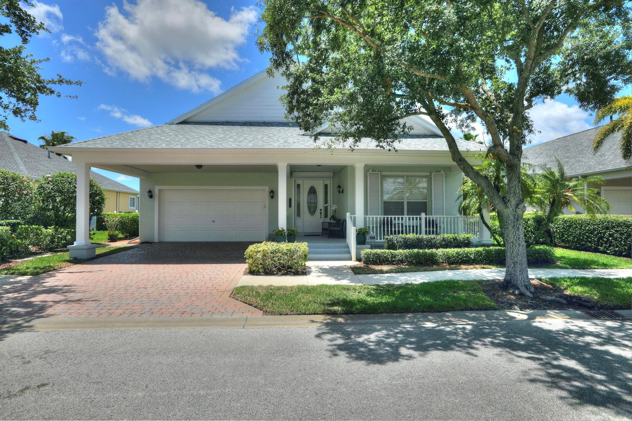 This stunning home, located directly on the golf course with a picturesque water view, is truly a dream come true. Featuring a two-car garage and a convenient double carport, there is ample space for all your vehicles. Custom hurricane shutters and new roof in Dec 2023 provides added protection. A covered front porch is perfect for enjoying your morning coffee. Crown molding & volume ceilings, add a touch of elegance to every room. The highlight of this home is the expansive lanai, which offers breathtaking views of the golf course. This outdoor oasis is the ideal spot for entertaining guests or simply unwinding after a long day. To ensure uninterrupted power supply, this home comes equipped with a GENERAC whole house generator.