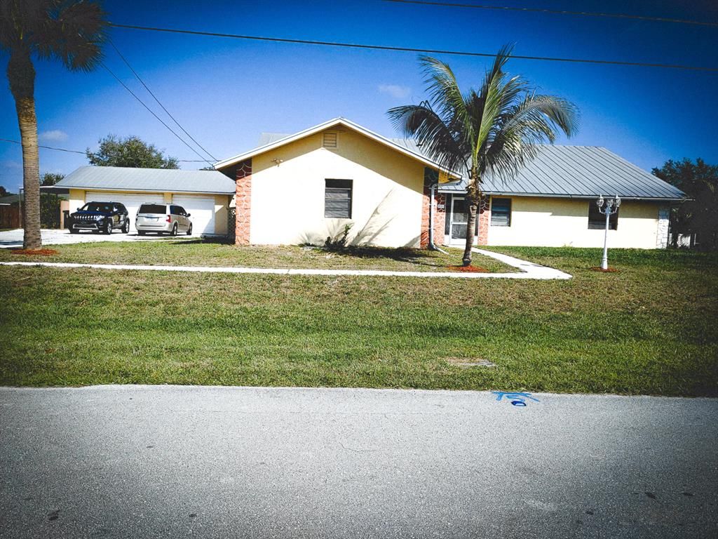 Photo of 891 SW Hamberland Avenue, Port Saint Lucie, FL 34953 (MLS # R10695148)