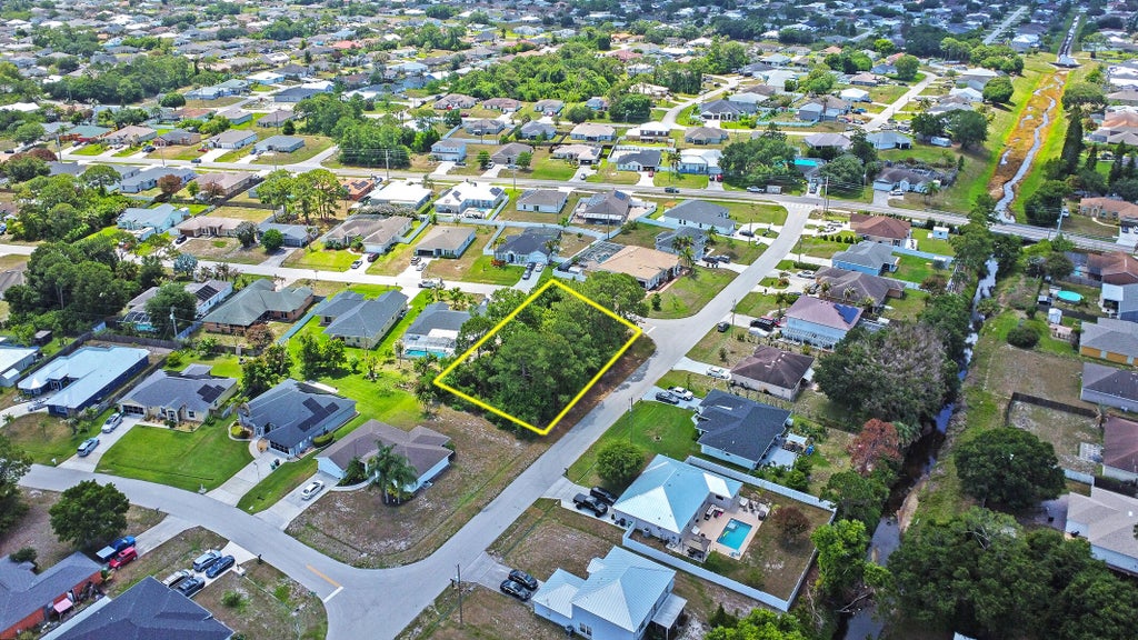 Photo of 1399 SW Halford Avenue, Port Saint Lucie, FL 34953 (MLS # B26034049)