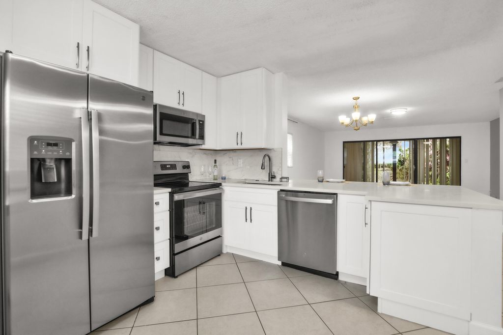 Photo of 2112 NW 45th Avenue, Coconut Creek, FL 33066 (MLS # B26039430)