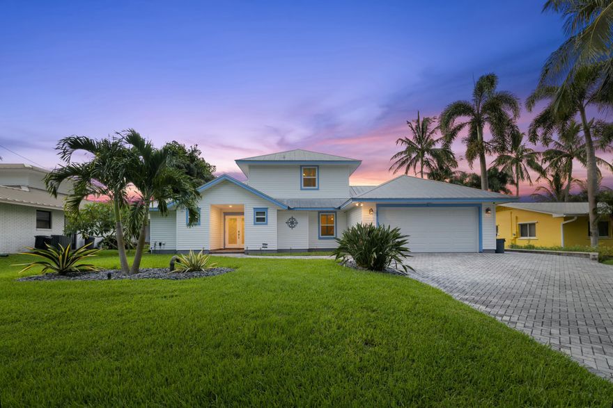 Your waterfront paradise awaits in the sought after waterfront community of Lighthouse point. Jump into a saltwater heated pool after a long day fishing. This is an entertainers dream with 2 tiki huts, LED lit pool and landscape lighting. A new 20,000 lb boat lift and top of the line kitchen. Upon entering the high vaulted ceiling and solid wood double helix staircase brining you to the primary suite. The master bath is large with his and her vanity, large walk in shower and closets. Kitchen offers Sub-Zero Fridge, Capital 6 burner gas range and a full butler pantry/laundry room with full size freezer. IMPACT windows, plantation shutters and a fully finished garage. Florida lifestyle is only a backyard away, and this one will definitley impress.