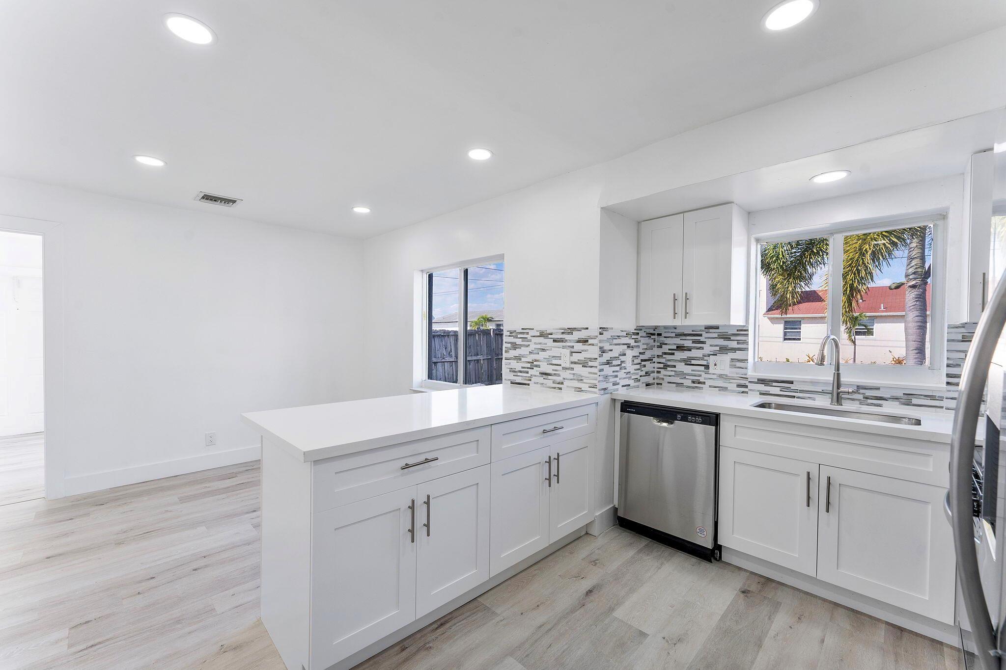 Come experience this stunning prime corner house, with an enclosed backyard located in the best part of Deerfield Beach, this fully remodeled home offers everything you need for luxury living. Featuring 4 spacious bedrooms and 2 baths, the home boasts a chef's kitchen with a large island, brand-new appliances, and an open-concept layout perfect for entertaining. Enjoy the convenience of a master suite, fully updated bathrooms, central air, and a washer/dryer. With its prime corner location, you're just minutes from the beach and other local attractions. Professionally managed to ensure top-notch service. First time ever on the market, won't last long