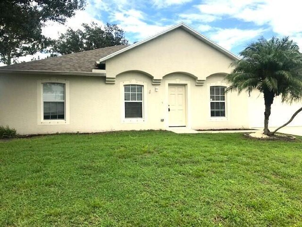 Photo of 513 SW Ester Avenue, Port Saint Lucie, FL 34984 (MLS # R10998932)