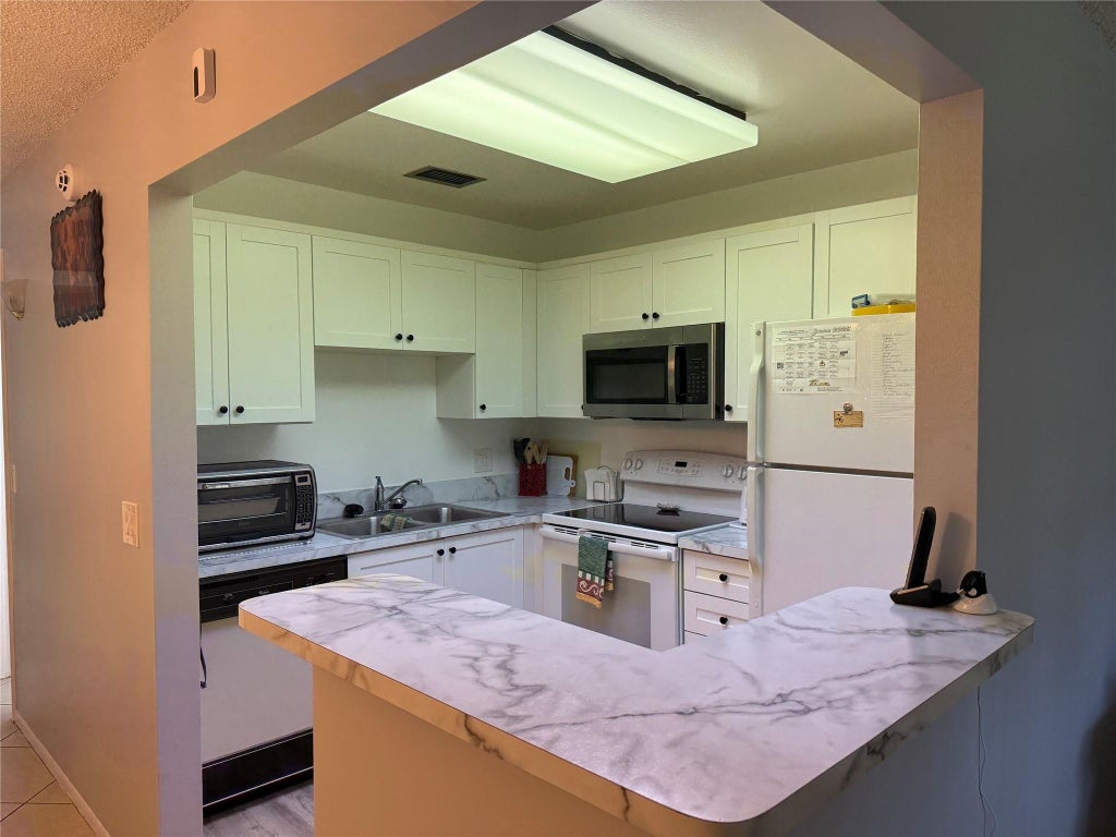 Photo of 10 Lake Vista Trail #204, Port Saint Lucie, FL 34952 (MLS # F10509299)