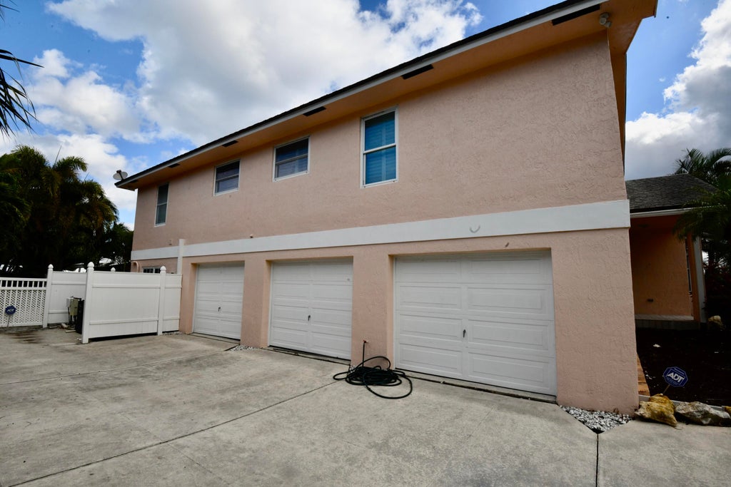Photo of 225 Cascade Lane, Palm Beach Shores, FL 33404 (MLS # R11042863)