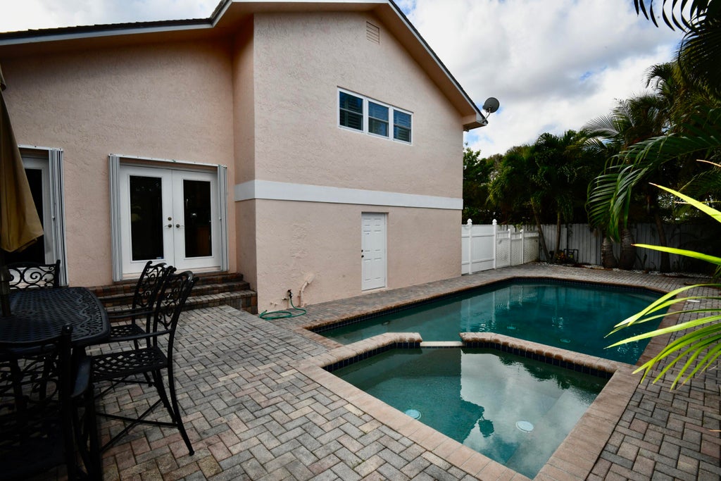Photo of 225 Cascade Lane, Palm Beach Shores, FL 33404 (MLS # R11042863)