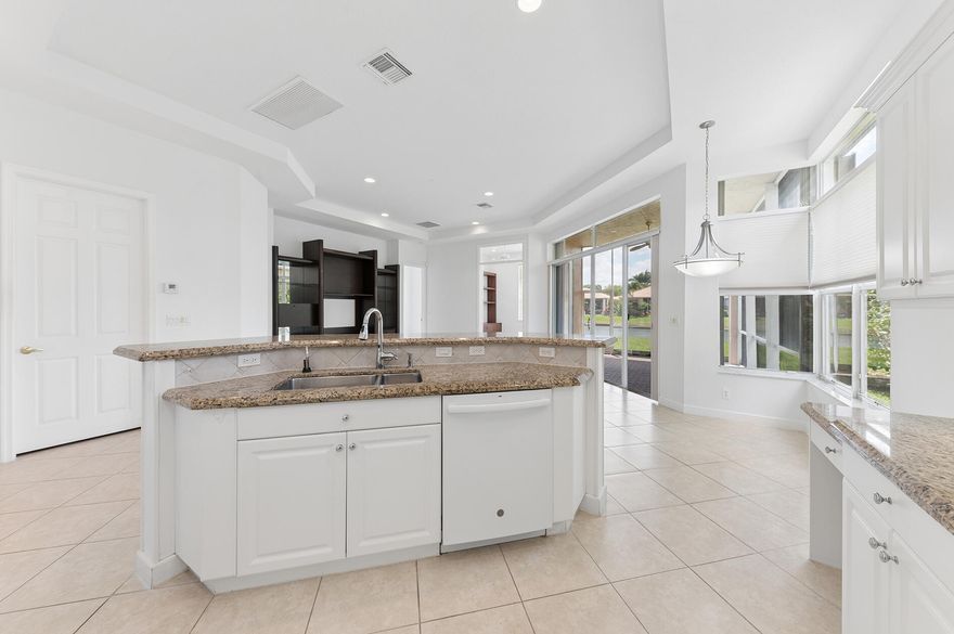 Welcome to this beautifully maintained 2-bedroom, 2-bath home with a versatile den/office, offering 1,851 square feet of comfortable living in the highly sought-after Buena Vida 55+ community. This light-filled residence features fresh interior paint and brand-new carpeting, creating a clean, move-in-ready feel throughout. The  spacious den includes custom built-ins, making it ideal for a home office, library, or hobby space. The primary suite offers built-in closets for optimal organization, while the split-bedroom layout provides privacy for guests.  Enjoy peace of mind with a new A/C unit and relax year-round on the screened lanai overlooking a tranquil lake—perfect for morning coffee or evening sunsets. Buena Vida offers an exceptional lifestyle with resort-style amenities,   including a grand clubhouse, café, state-of-the-art fitness center, multiple pools, spa, tennis and pickleball courts, library, and more. Experience active adult living at its finest in this vibrant, amenity-rich community.  Don't miss this opportunity to own a serene lakefront home in one of the area's premier 55+ communities.