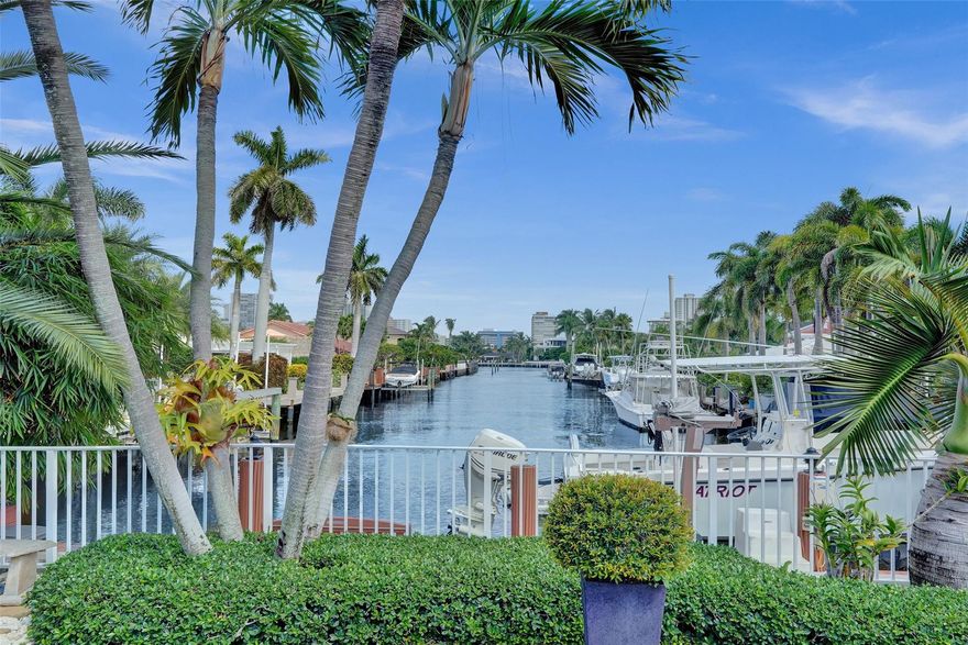 Stunning views looking down the canal towards the Intracoastal from almost every room. The view is a 10/10 and will not disappoint. Live the boating dream with 71’ of waterfront and a 10kLB boat lift in place.  Oversized lot (12,372 sq ft) offers a huge pool that screams fun, fantastic landscaping, huge paver deck and a private hottub. Large covered porch feels like an extra living room with built in summer kitchen. One of the larger single story homes with approx 3400 sq ft of living space! Incredible great room as you enter the house that spans nearly 50 feet giving you those “WOW” views.  Huge master suite with massive walk in closets (4!) and spacious bath that has been beautifully renovated. Newer metal roof and all Hurricane Impact doors and windows. Fully gated for privacy.