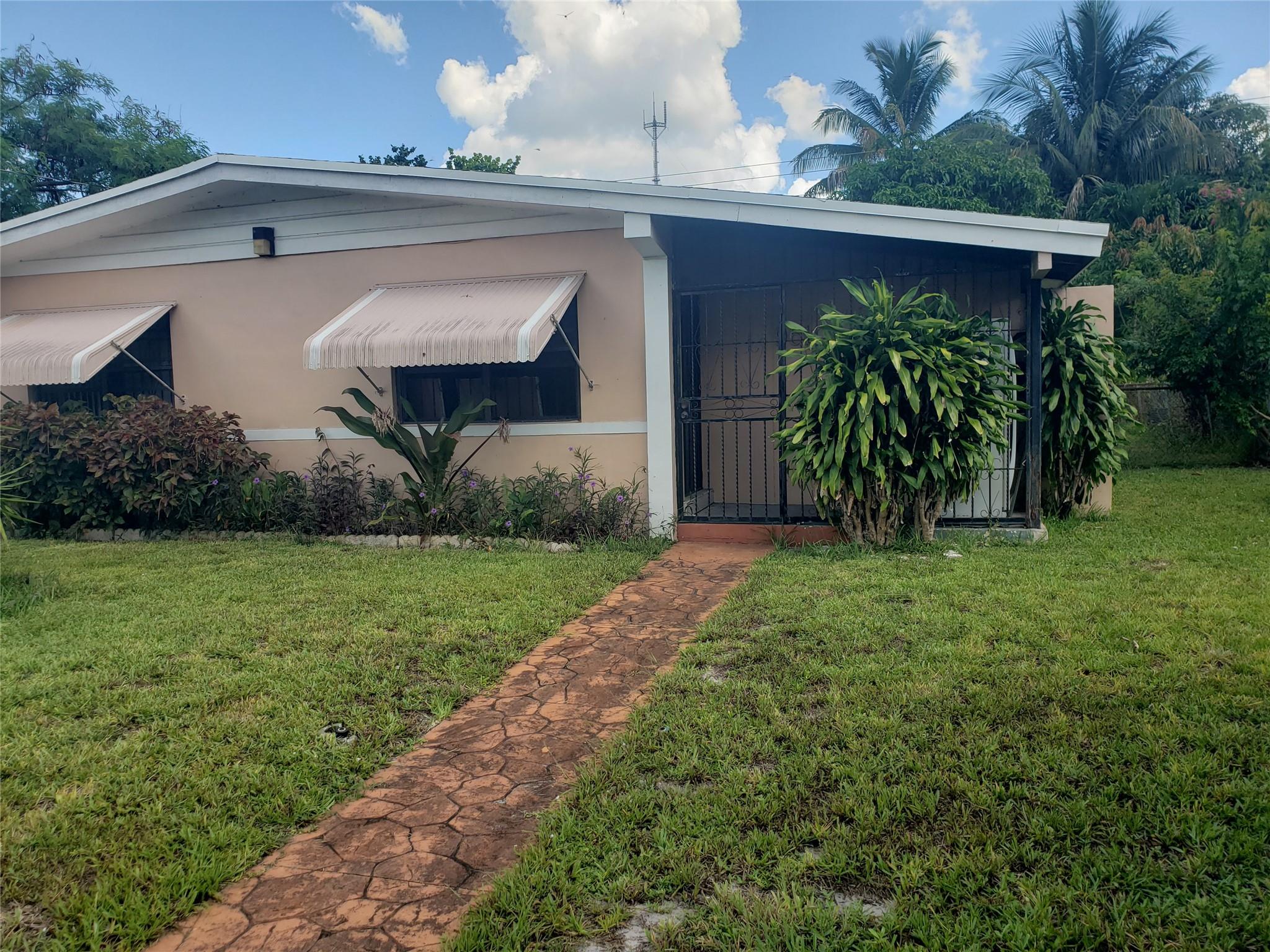 *MORE PICTURES COMING SOON* Spacious 4 Bedroom 2 Bathroom House with separate utility room and carport with additional room that can be use for bedroom or family room. Vacant and ready for immediate occupancy. Walking distance to Norland elementary, middle and high schools and Hard Rock Stadium.