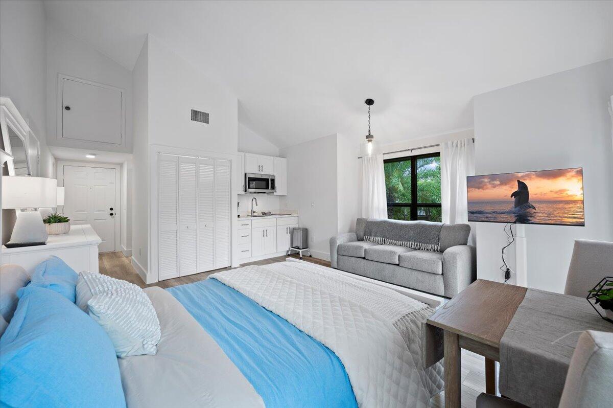 Beautifully renovated studio condo with vaulted ceilings and gorgeous light. This unit has everything you need (including a pond view with an occasional otter sighting), and is walking distance to the community pool and restaurants. Located within the gates of prestigious Palm Beach Polo Club FULLY FURNISHED OFF SEASON RENTAL. 13% tax on all leases shorter than 6 months and one day. Tenant to pay $200/mo flat Utility Fee (covers electric, water, wifi).